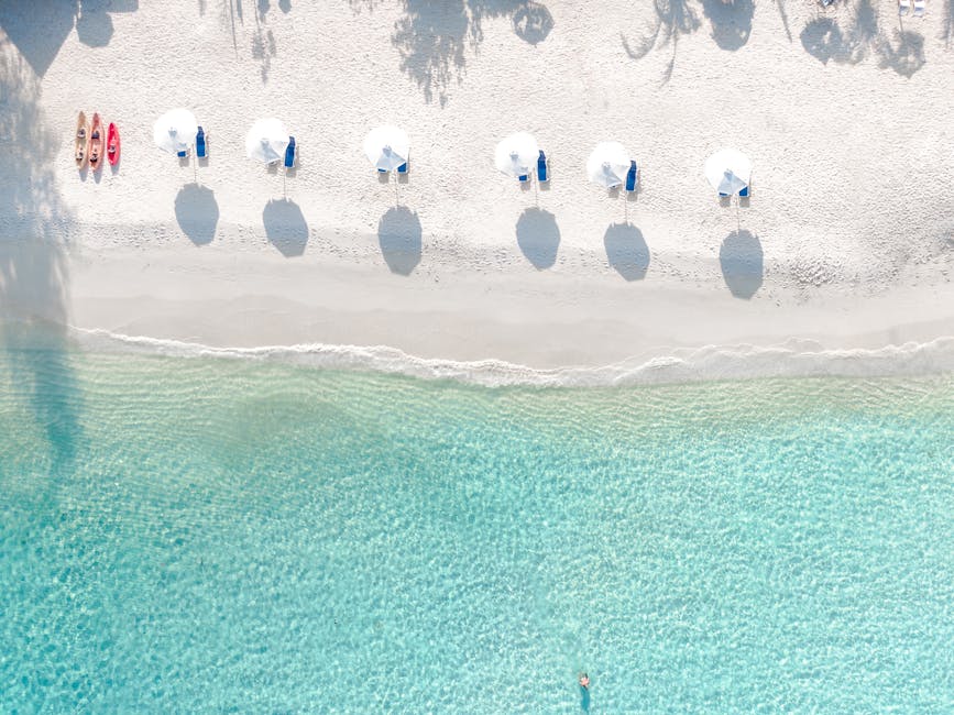 Villas With Hammocks Over Crystal Waters